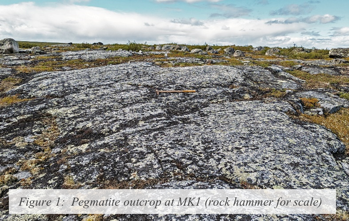 Figure 1:  Pegmatite outcrop at MK1 (rock hammer for scale)